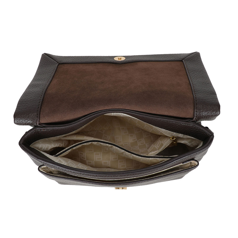 Dark brown leather bar flap crossover crossbody bag with suede interior and gold-tone hardware