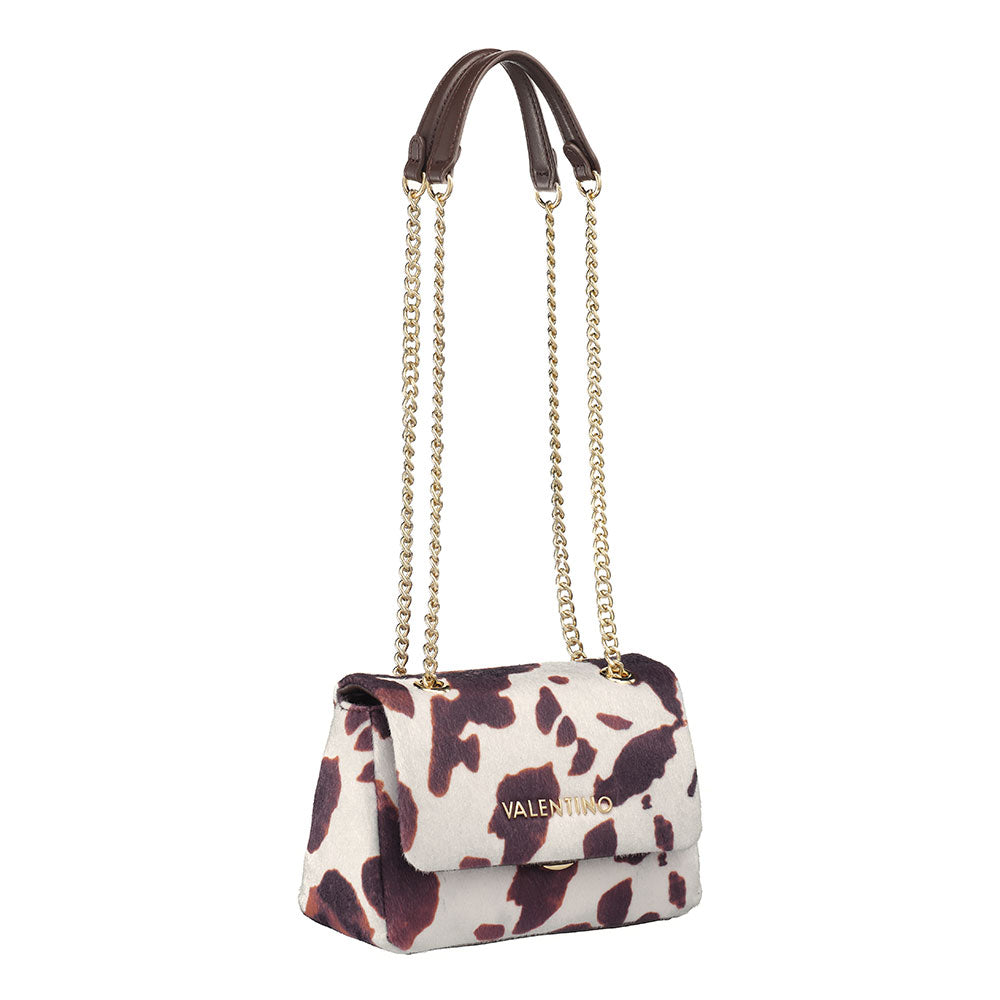 A valentino ocarina winter flap bag with white and brown cow print leather and gold-tone chain strap