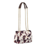 A valentino ocarina winter flap bag with white and brown cow print leather and gold-tone chain strap